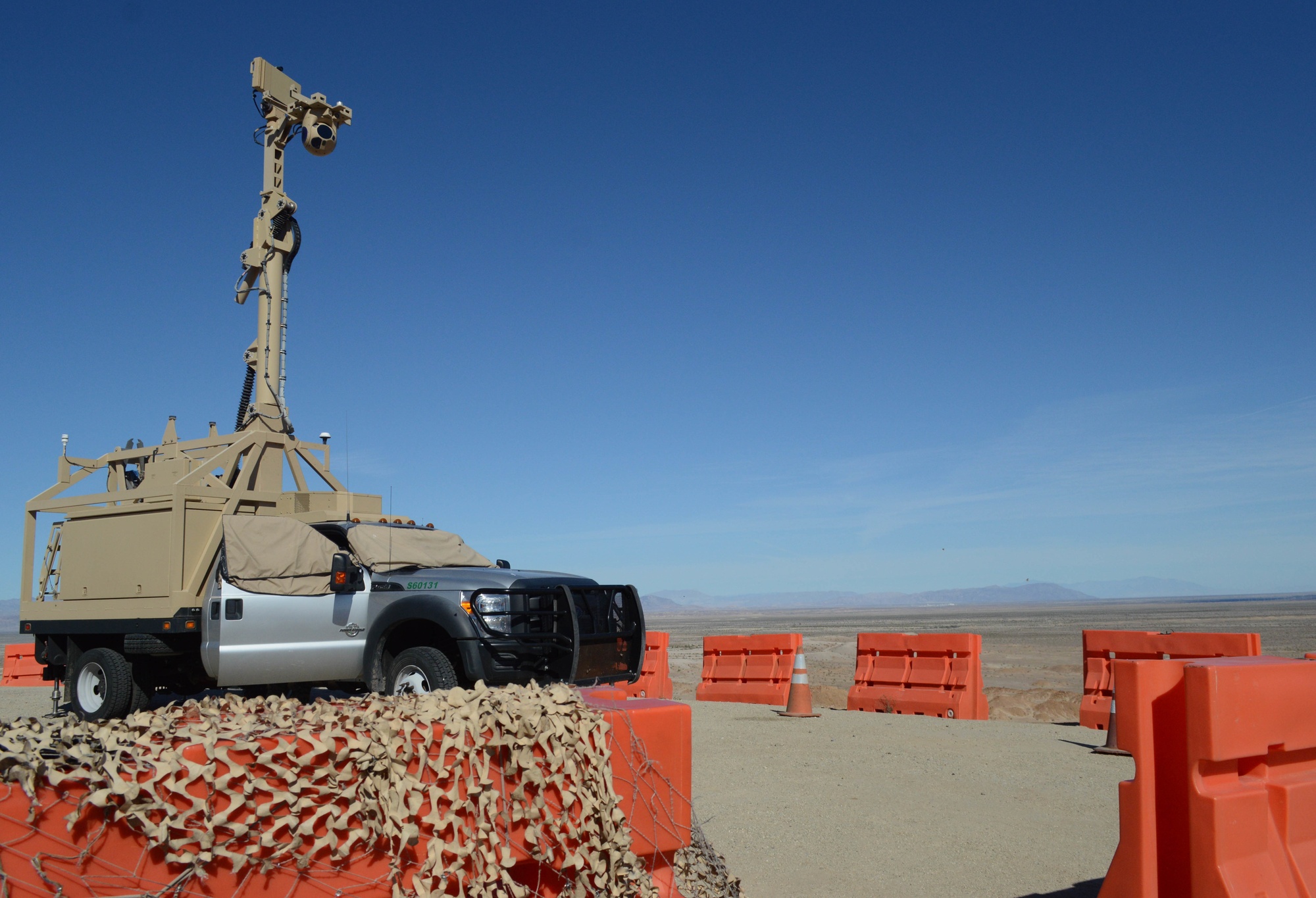 Border surveillance equipment positioned on elevated terrain in El Centro